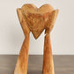 Large Hands Holding Heart Sculpture (Visible Cracking)