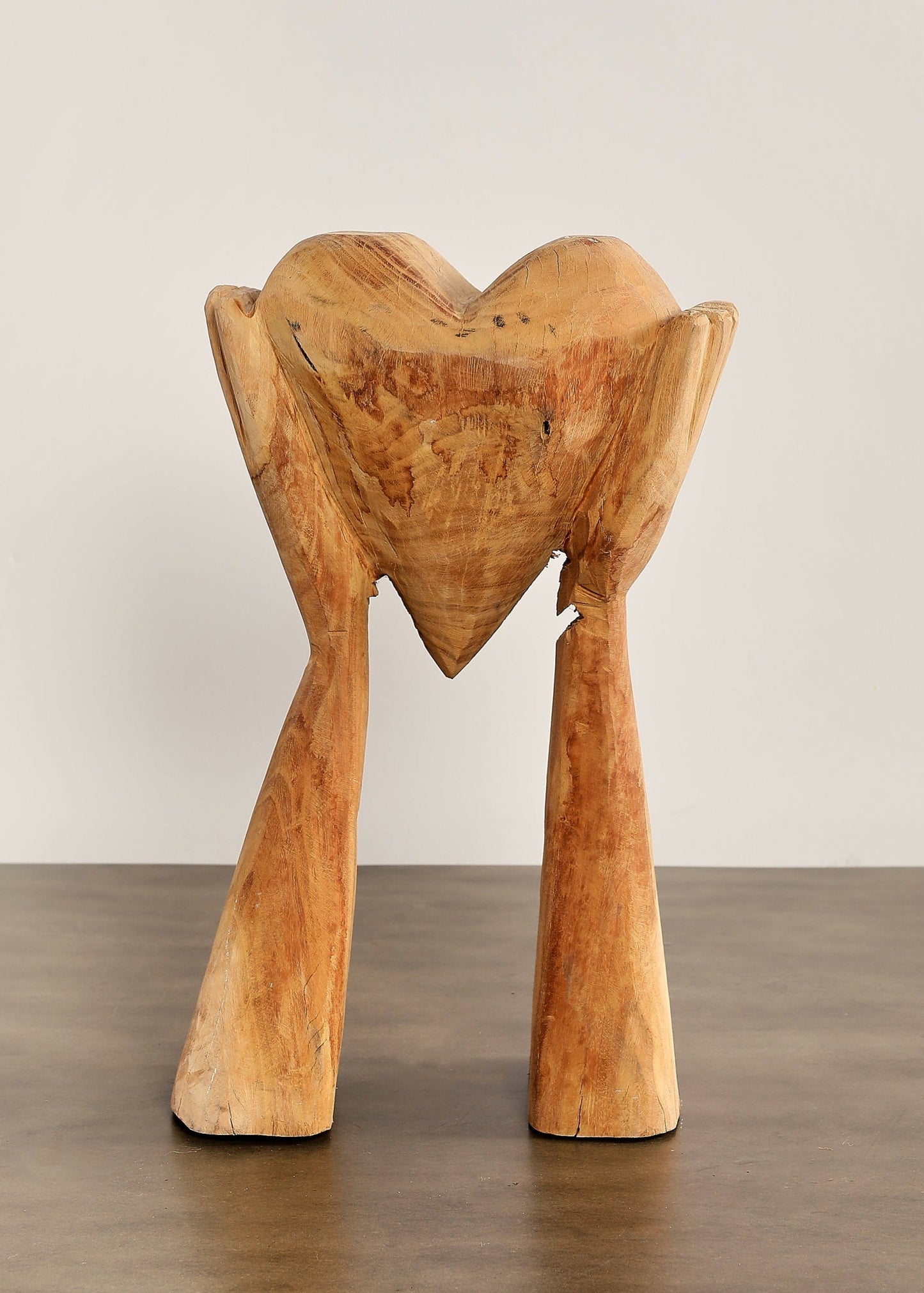 Large Hands Holding Heart Sculpture (Visible Cracking)