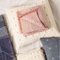 Silica Rose In Shades of Salmon Gray Stripes Pattern Soft Handwoven Merino Throw