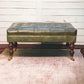 Buffalo Leather Upholstered Ottoman with Castor Legs