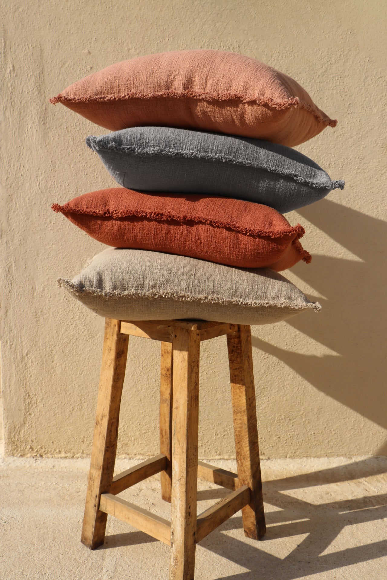 Organic Chic washed textured cotton solid lumbar pillow cover with frayed edges