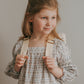 The Eloise Ruffle Backpack-Wildflower Cream